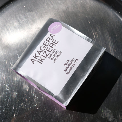 Product packaging labeled 'Akagera Ikizerere' on a metallic surface